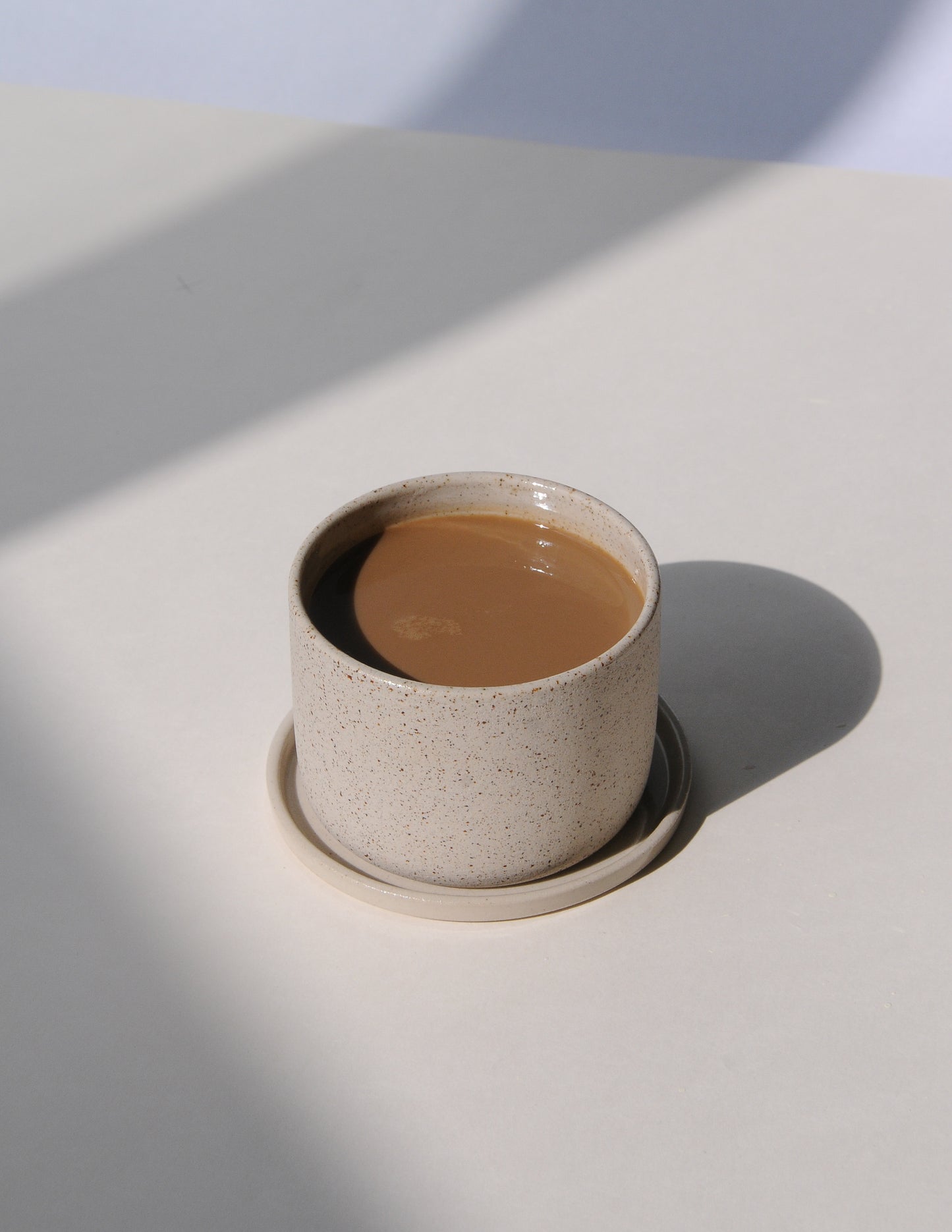 SAND Becher mit Untertasse